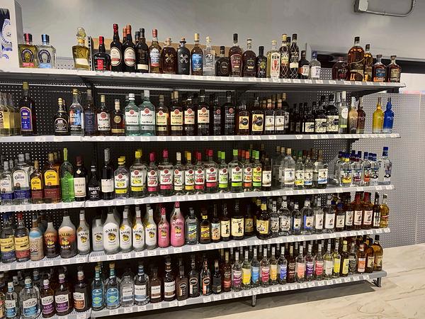 Spirits aisle shelves stocked top to bottom