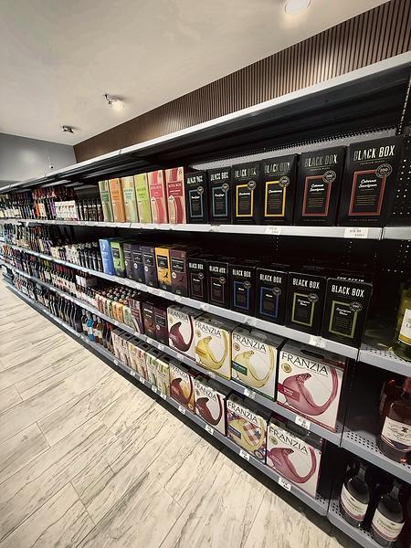 Boxed wines and bottles lining the wine aisle