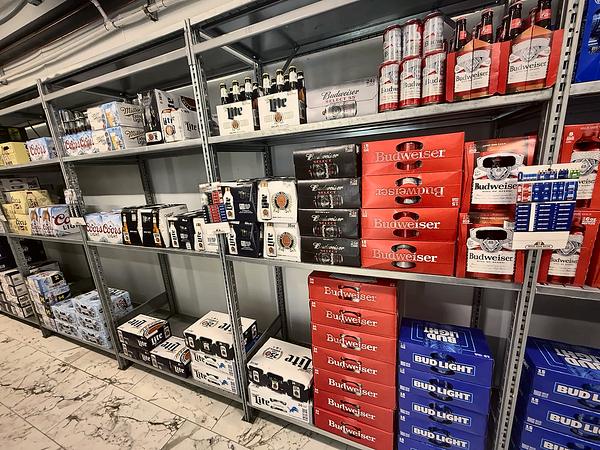Beer shelves with cases stacked to the floor